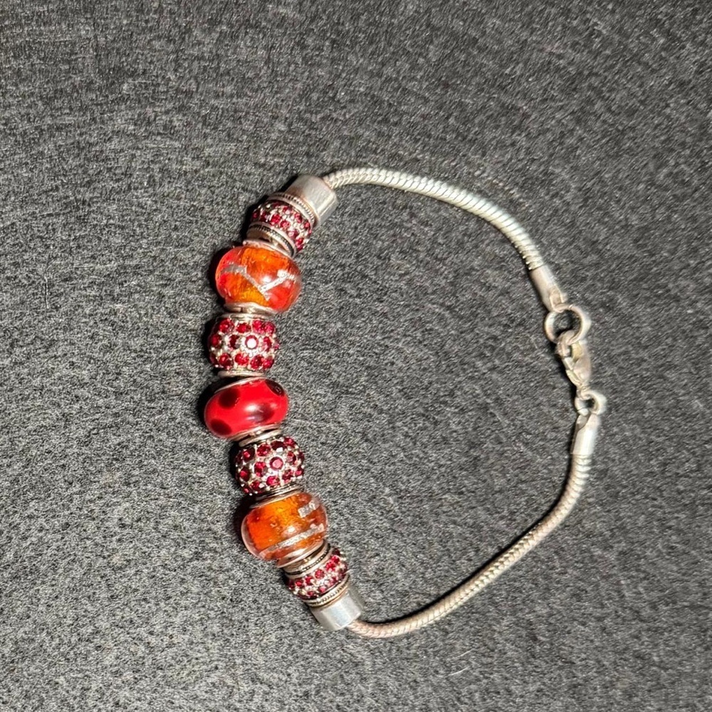 Elegant Silver Tone Charm Bracelet with Red & Orange Glass Beads
